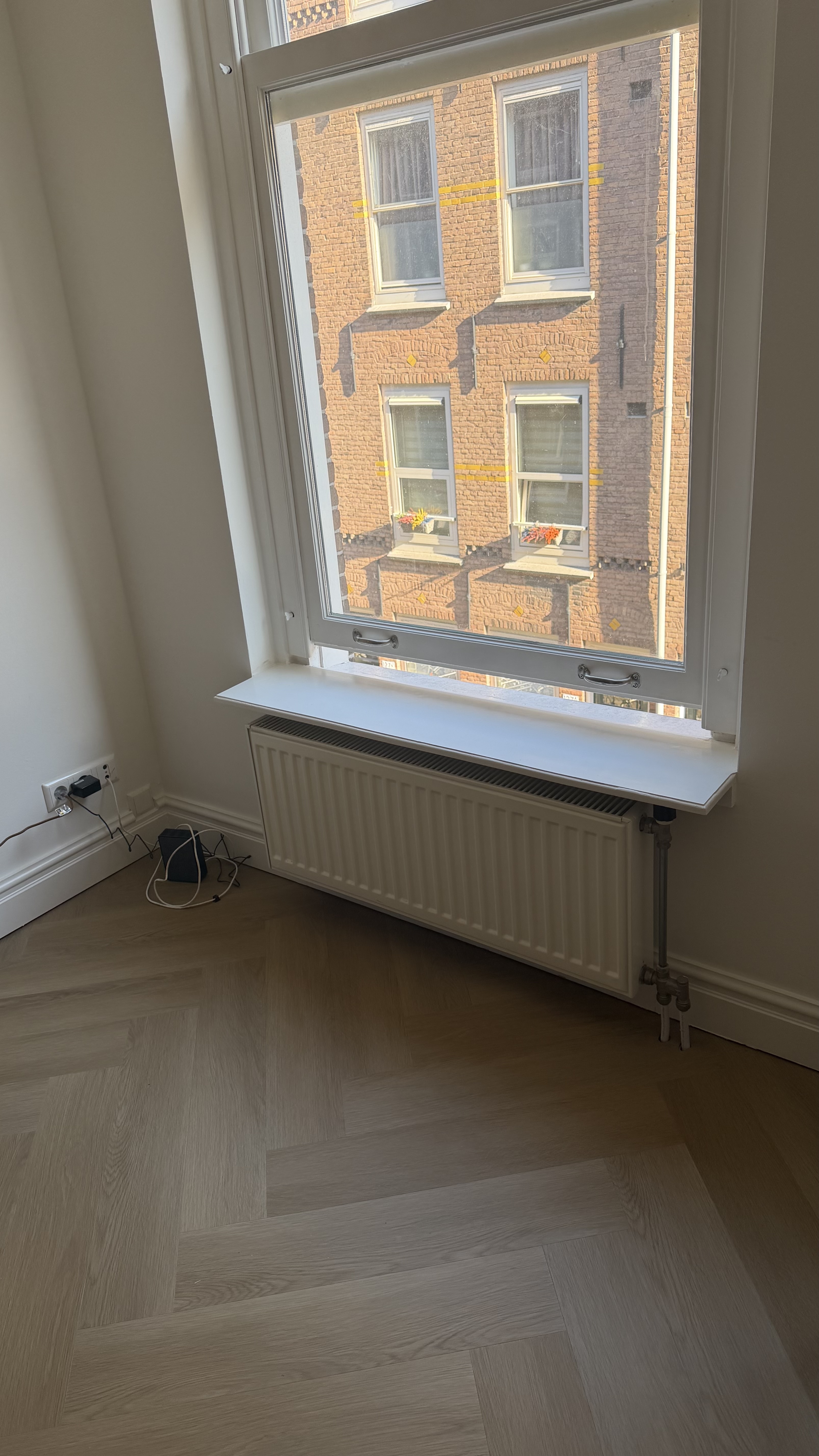 Empty window nook before a custom sitting bench design